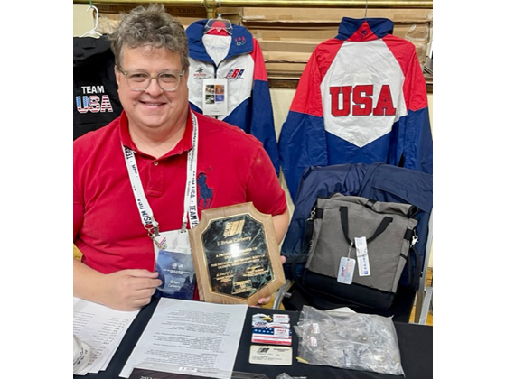 Brian Carberry volunteers to sell USA shooting & skating garb