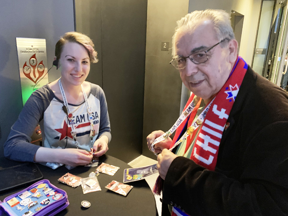 Luis Rojas trades pins with an enthusiastic museum staffer